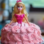 A Barbie doll cake decorated with pink frosting roses and a shimmering pink bodice.