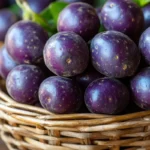 Close-up of vibrant purple potatoes on a rustic wooden table.